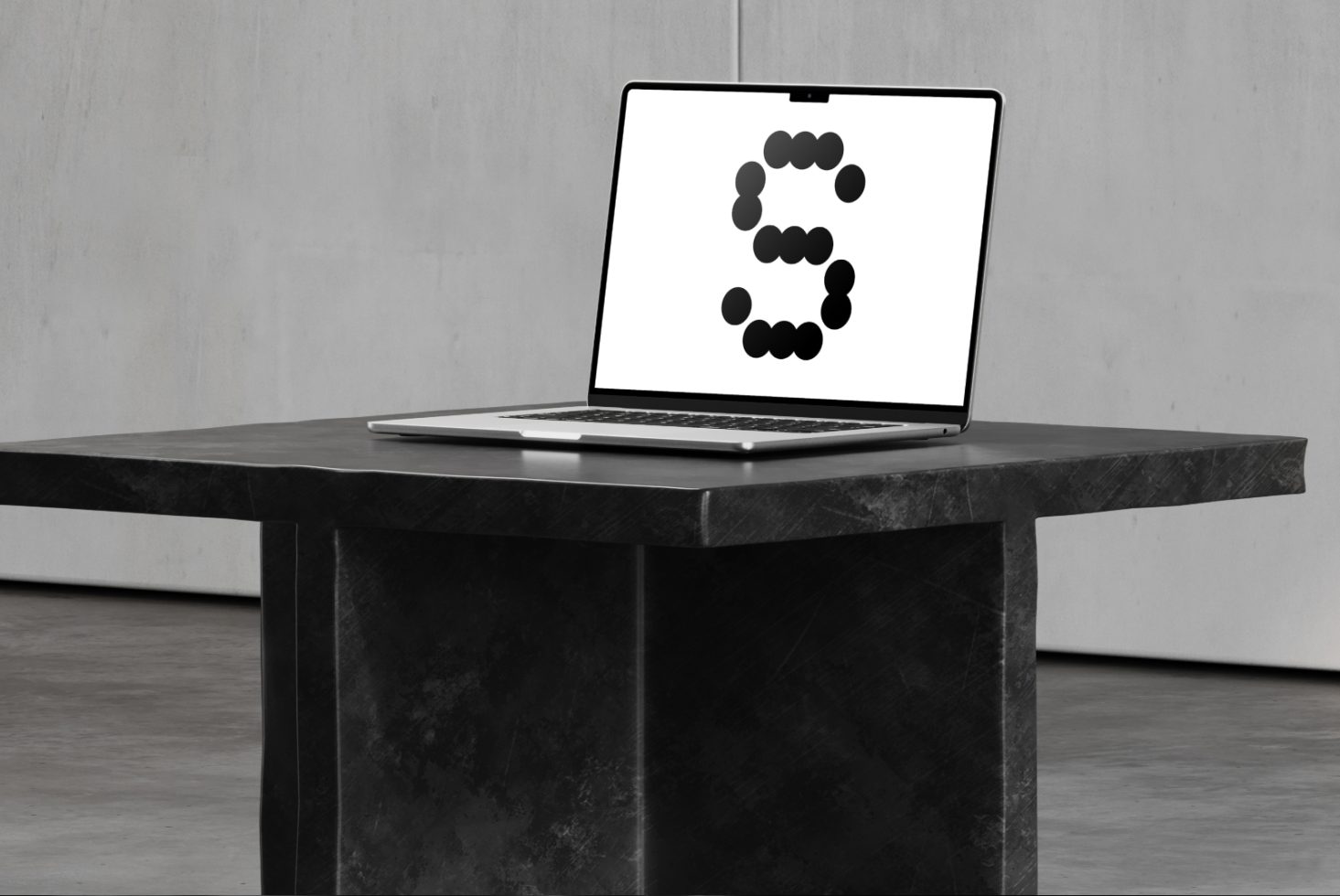 Laptop on dark table showing graphic letter S in dots. Ideal for designers seeking unique font mockups or digital assets. Studio background.