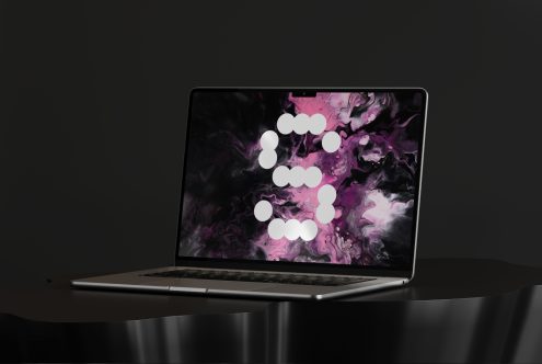 Laptop mockup with abstract pink and black swirling background. Ideal for digital design projects. Keywords: mockups, digital assets, designers.