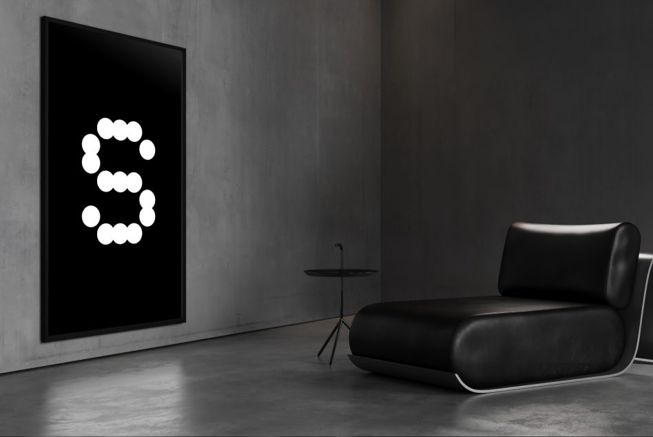 Minimalist gallery space with black wall display showing dotted number