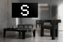 Modern lounge with wall-mounted screen featuring dotted number graphic