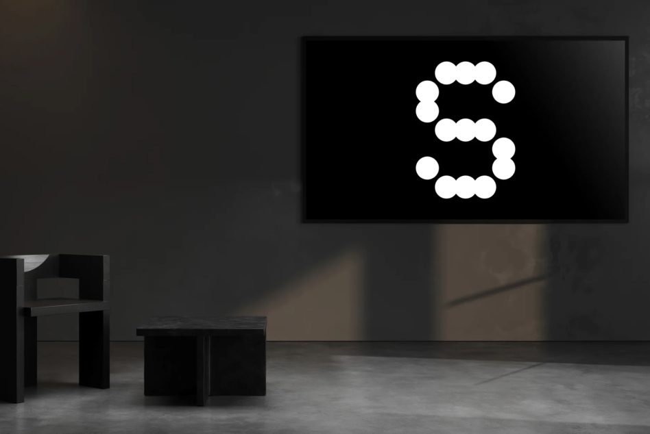 Modern interior design mockup featuring a black wall art with a large stylized letter S glowing in white dots. Ideal for creative digital assets.