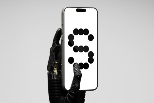 Robotic hand holding smartphone mockup with bold dot font on screen. Futuristic tech design for digital assets. Innovative graphic template for designers.