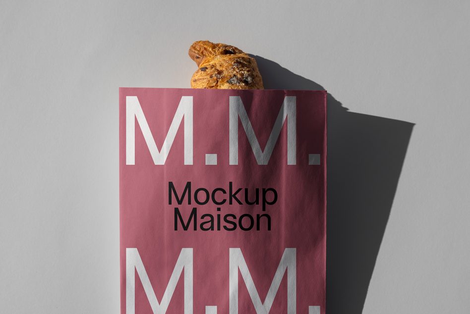 Elegant paper bag mockup with branding text M M M on a plain background suitable for designers needing mockups for products packaging branding design.