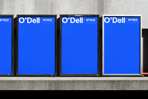 Blue poster mockups aligned on a concrete wall background ideal for showcasing typography designs, templates, or graphics in digital asset marketplaces.