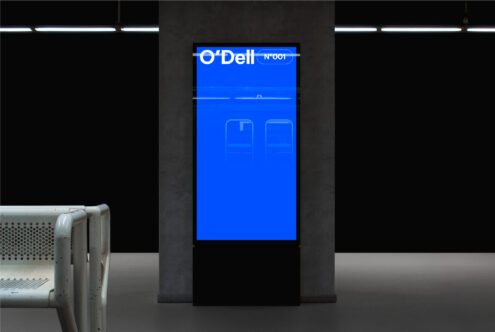 Digital signage mockup in a modern interior featuring a bright blue screen with text O'Dell N001; ideal for presentations and advertising display designs.