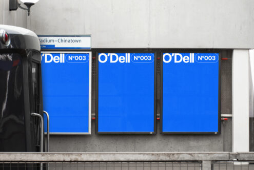 Three blue advertising mockups on a concrete wall at a stadium subway station ready for custom designs perfect for graphic designers and branding projects.