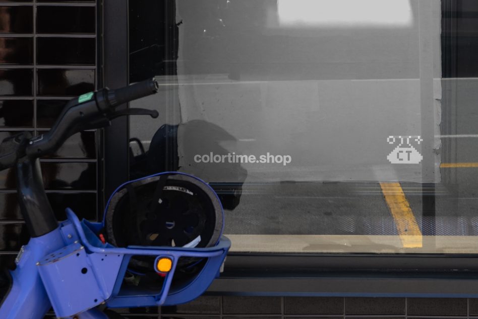 Urban street scene photo mockup featuring a blue bike in focus with a blurred cityscape background. Ideal for branding and commercial graphics.