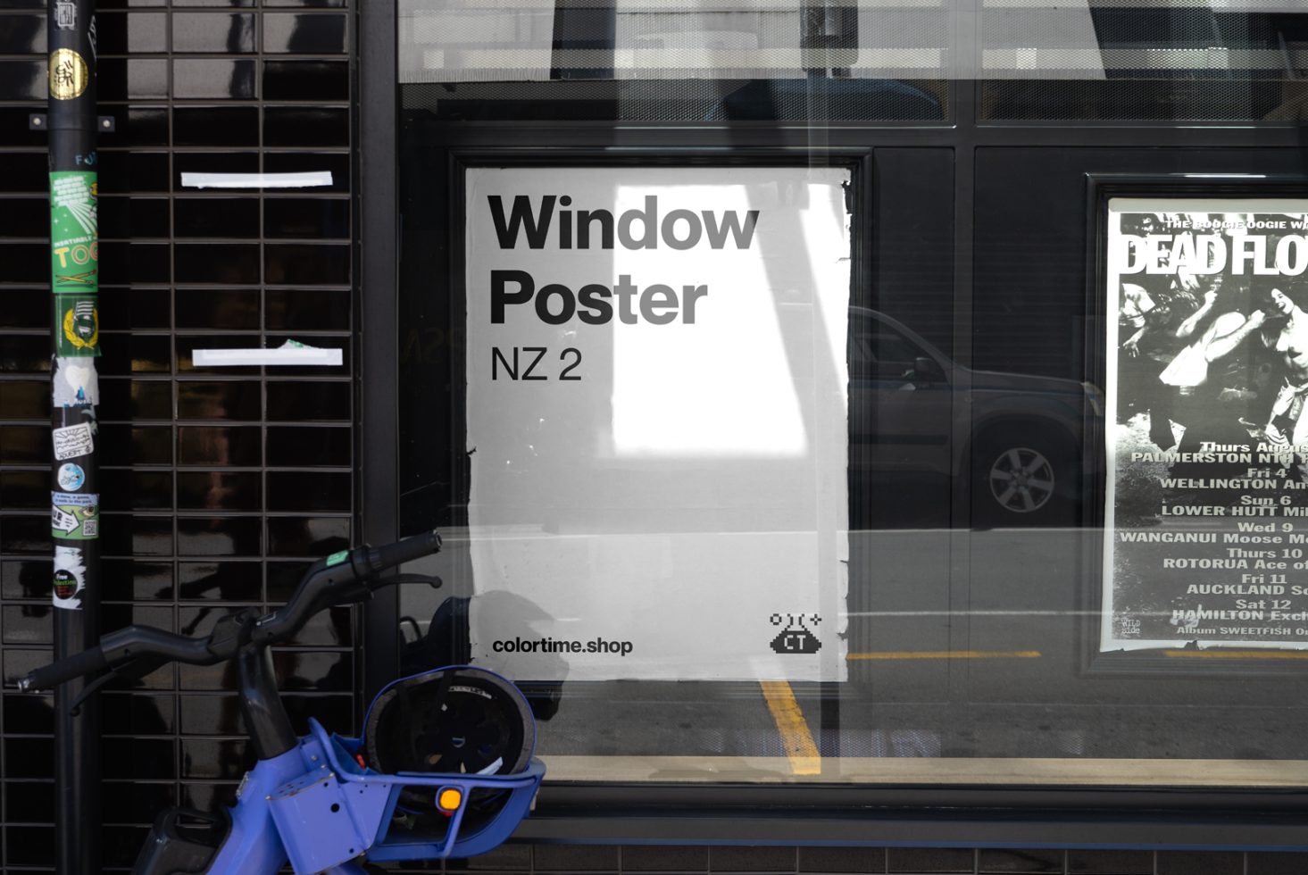 Urban window poster mockup in a city setting with bicycle and reflection. Ideal for showcasing poster designs. Keywords: Mockup, Poster, Urban, Design.