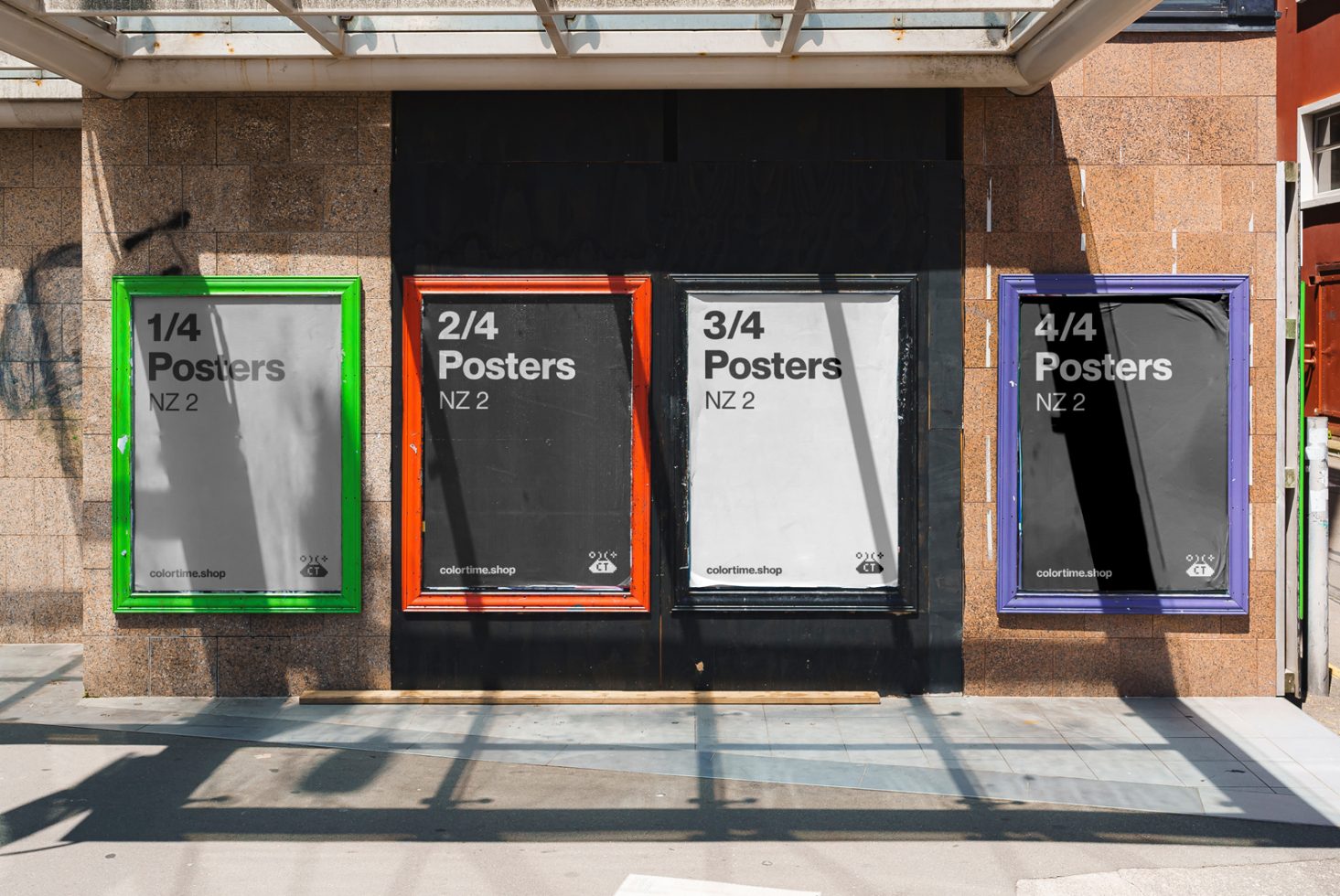 Mockup of four colorful outdoor poster frames with different proportions on a sunlit urban wall. Perfect for showcasing graphic design templates.