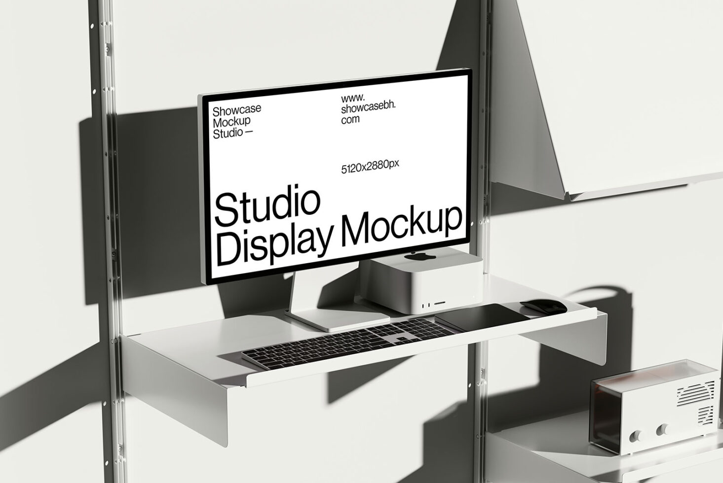 Studio display mockup on a minimalist desk setup for designers. Includes a high-resolution monitor, keyboard, and mouse. Ideal for design presentations.