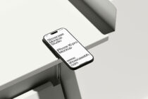 iPhone 16 Pro mockup with white screen angled on geometric white platform