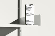 iPhone 16 Pro mockup with white screen on white shelf between metal dividers