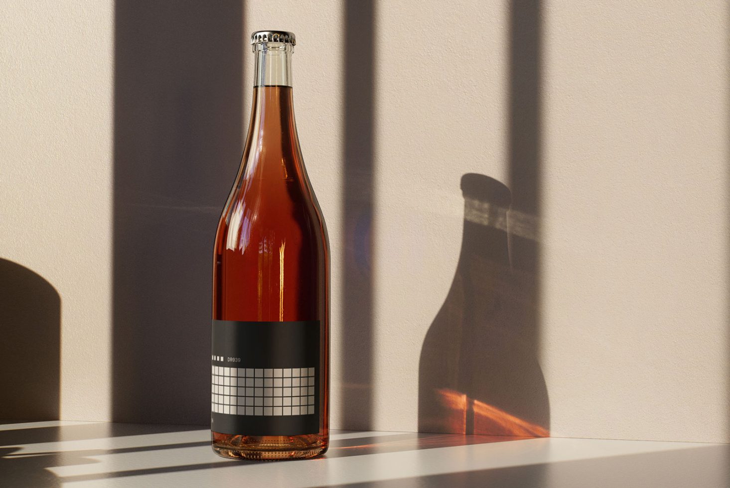 Brown glass wine bottle on table with geometric label design casting shadow on wall. Ideal for packaging mockup, product presentation, graphic design.