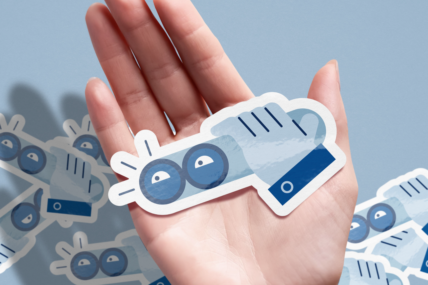 Cartoon hand with eyes sticker held in palm with other stickers in background suitable for graphic designers and mockup projects digital asset marketplace.