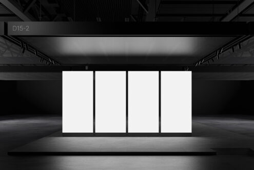 Minimalist exhibition booth mockup in a dimly lit space perfect for showcasing branding or design assets. Ideal for designers needing realistic templates.