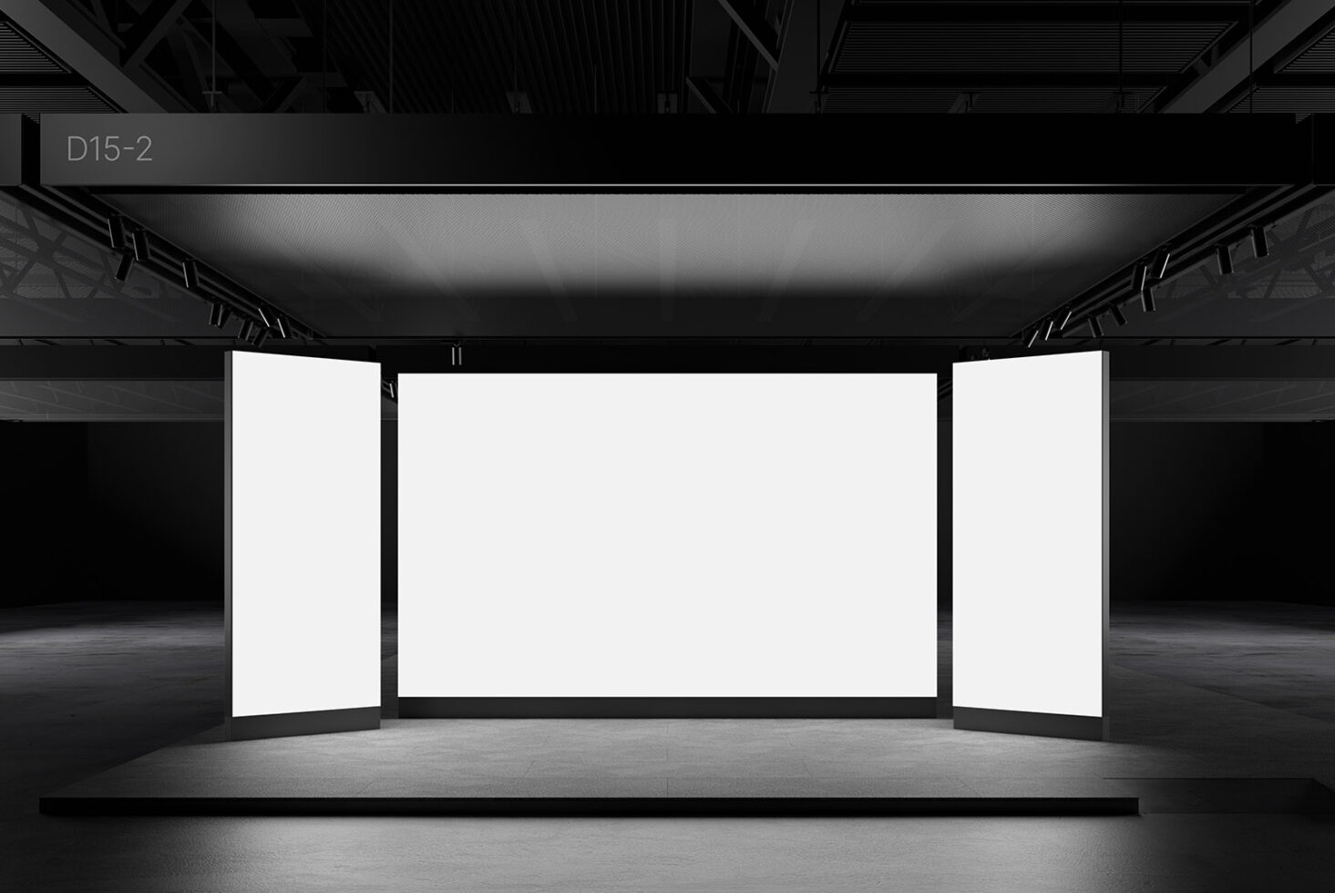 Minimalist exhibition booth mockup with blank panels in a dark industrial setting. Ideal for designers seeking realistic templates for trade show displays.