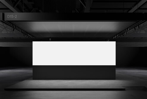 Minimalist black and white exhibition stand mockup ideal for designers. Sleek modern display in an industrial setting perfect for showcasing graphics.