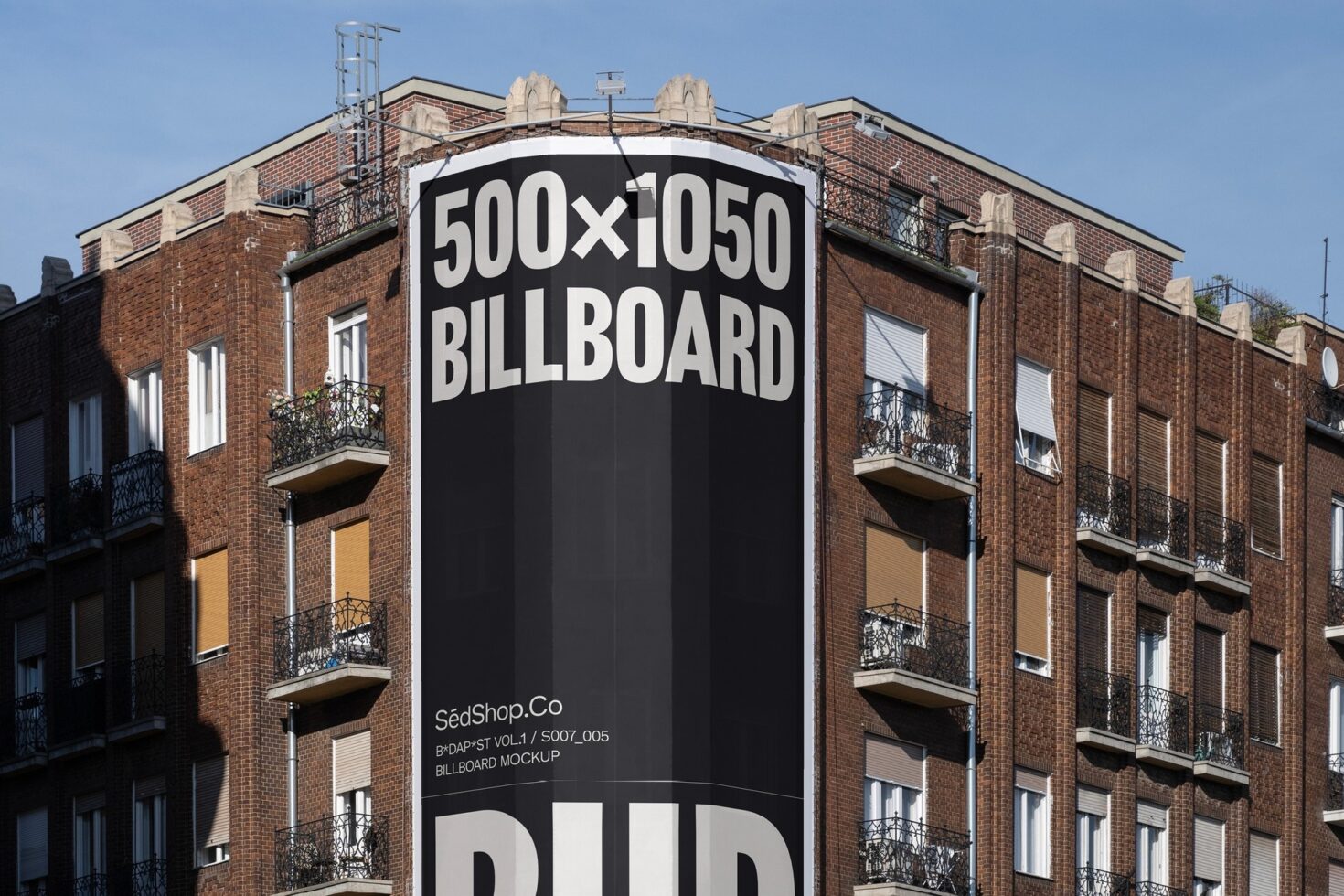 Urban billboard mockup on a red brick building showcasing 500x1050 dimensions for graphic designers digital assets template marketing outdoor display.