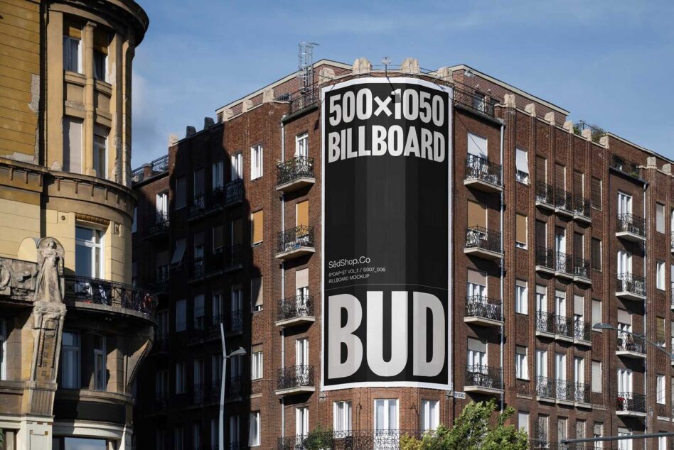 Curved building corner with large black billboard mockup displaying sample text