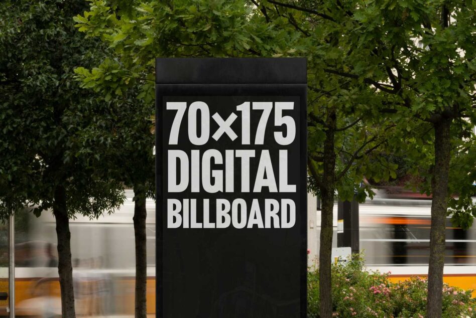 Digital billboard mockup in urban setting surrounded by greenery. Perfect for designers seeking outdoor advertising templates. Size 70x175 for graphic projects.