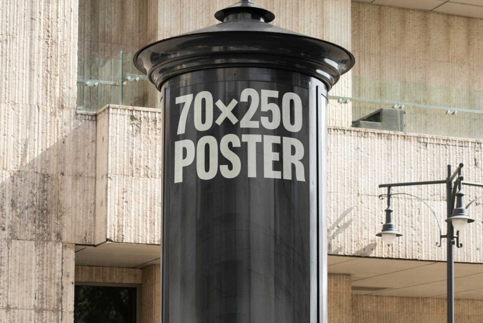 Mockup of a black cylindrical poster stand displaying 70x250 poster size outdoors in an urban setting great for advertising and design presentations.