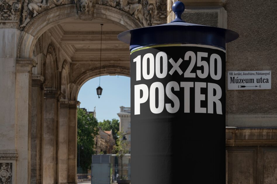 Street poster mockup 100x250 on a black column with classical architecture backdrop optimized for designers. Keywords: mockup urban display graphic.