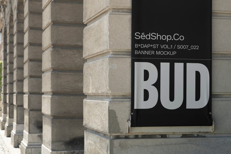 Urban banner mockup displayed on a stone building facade showcasing bold typography. Ideal for graphic designers seeking realistic presentation templates.