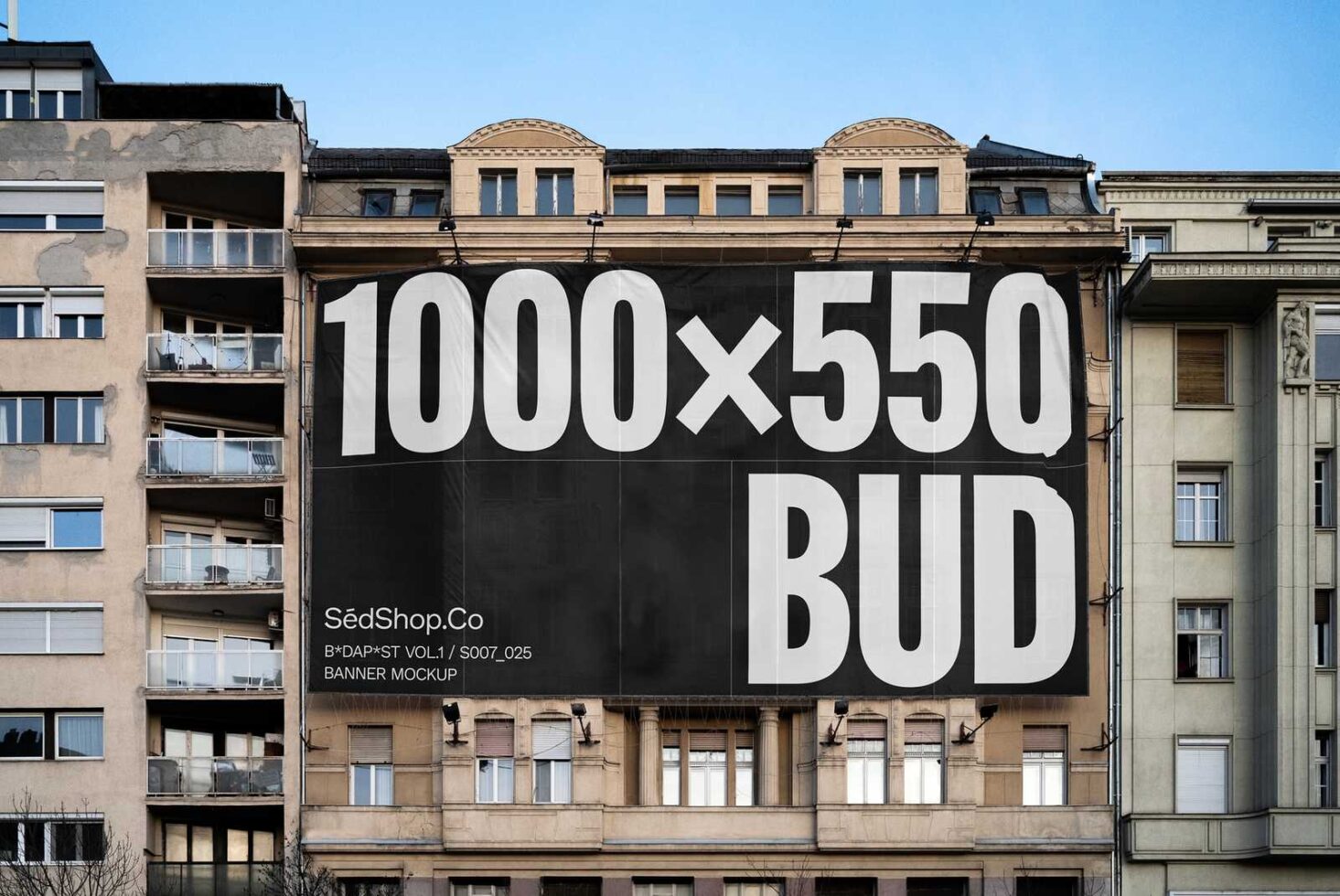 Urban banner mockup on a building facade with large dimensions 1000x550. Ideal for showcasing advertising designs. Keywords: mockup urban design banner.