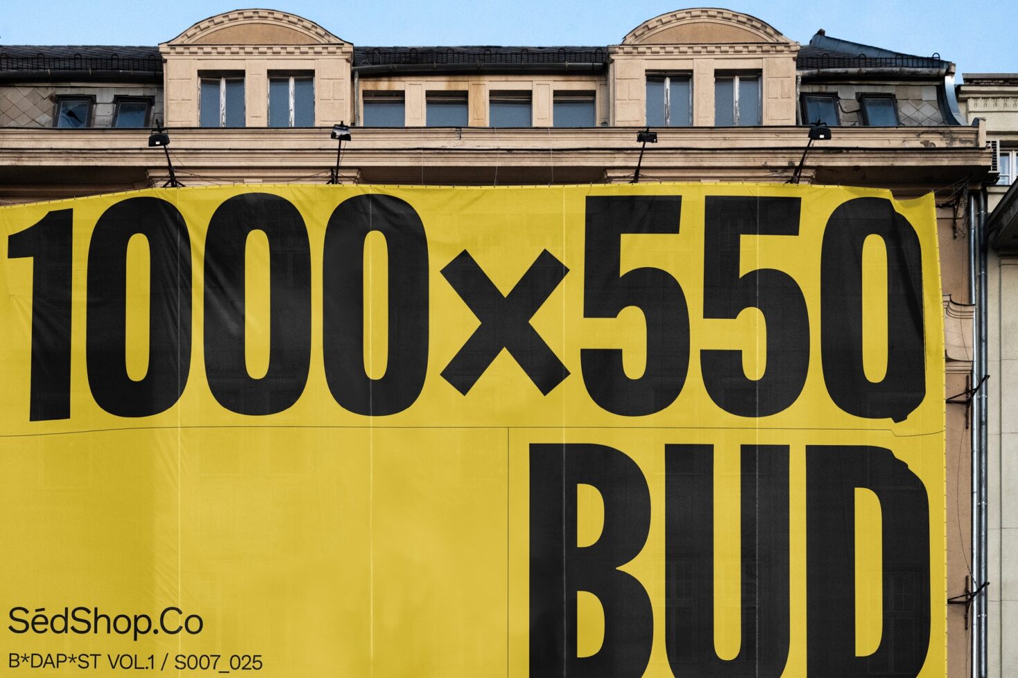 Yellow building banner mockup featuring bold black typography reading 1000x550. Ideal for designers in need of customizable advertising templates.