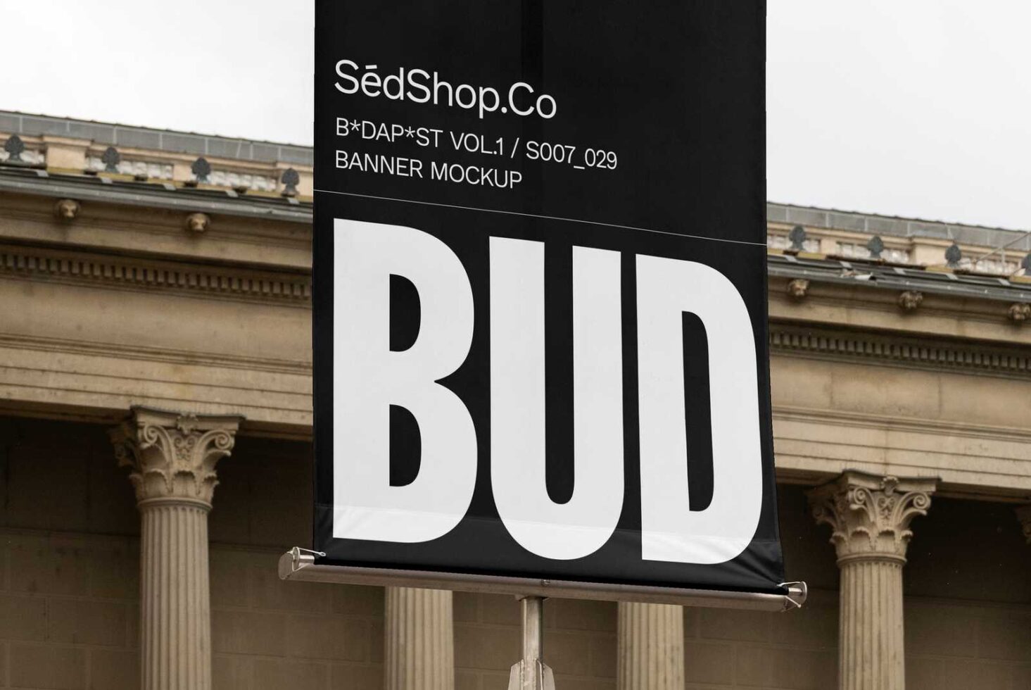 Outdoor banner mockup displaying bold typography in front of historical building columns ideal for graphic designers and marketing creatives crafting visuals