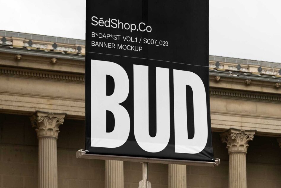 Close up black banner with large white BUD letters, architectural columns background