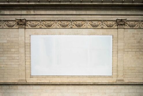 Blank billboard mockup on ornate stone wall perfect for advertising campaigns architectural backgrounds designers large format print templates SEO alt text