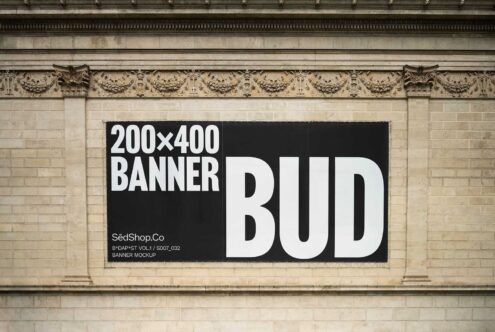 Urban banner mockup on ornate building facade displaying bold typography ideal for showcasing graphic design and advertising templates for designers.