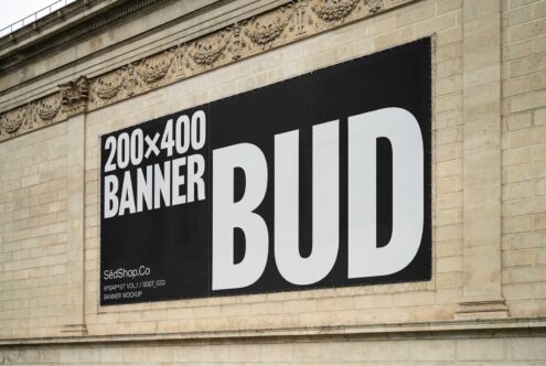 Large urban banner mockup on a stone building facade, ideal for graphic designers seeking high-quality templates for advertising and design presentations.