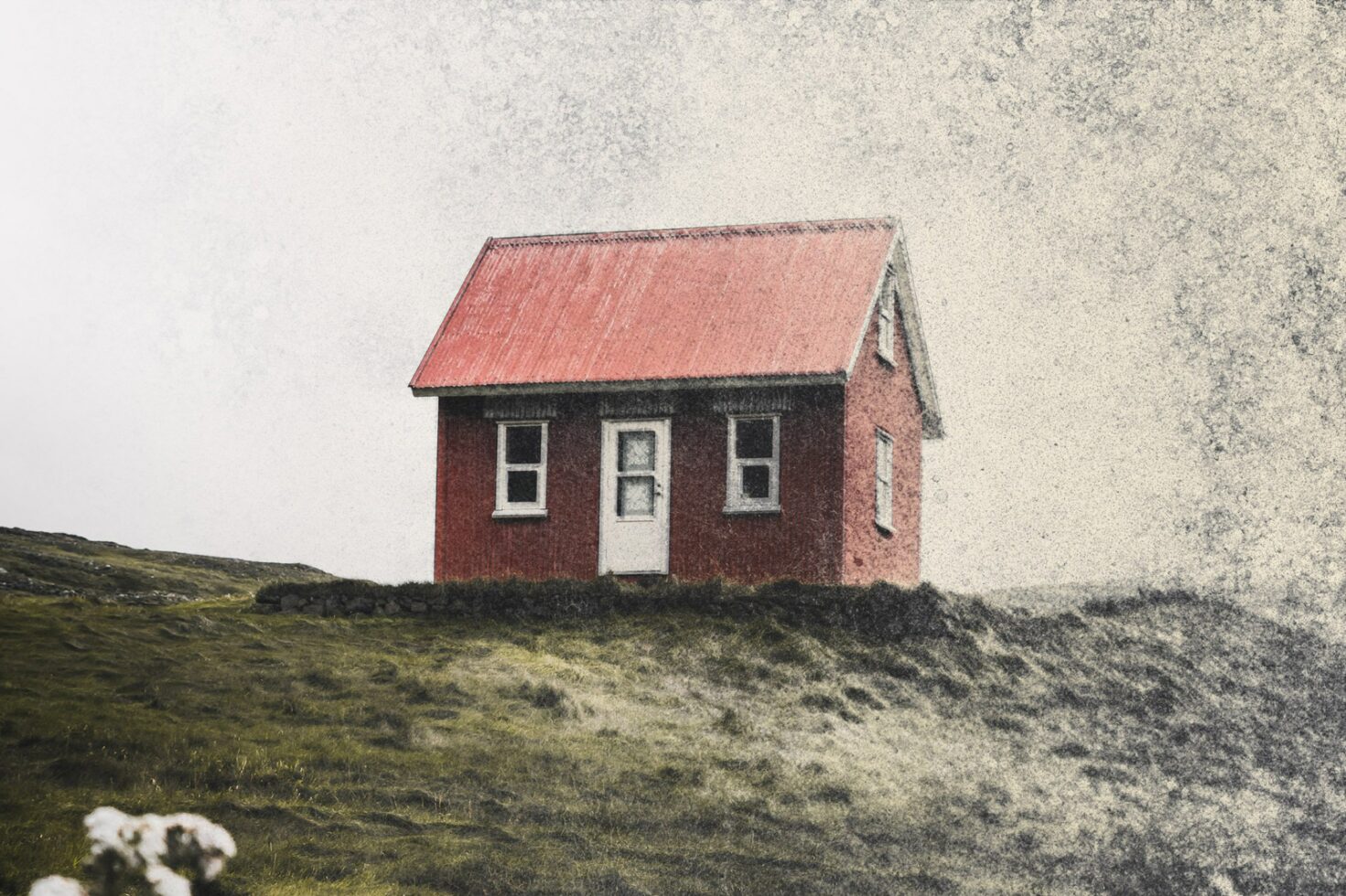 Vintage style image of a small red house on a hill with a textured background perfect for graphic design projects architectural mockups and rustic templates