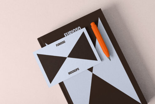 Mockup template featuring a black and white geometric design on a book cover with an orange pen on a beige background ideal for graphic designers.