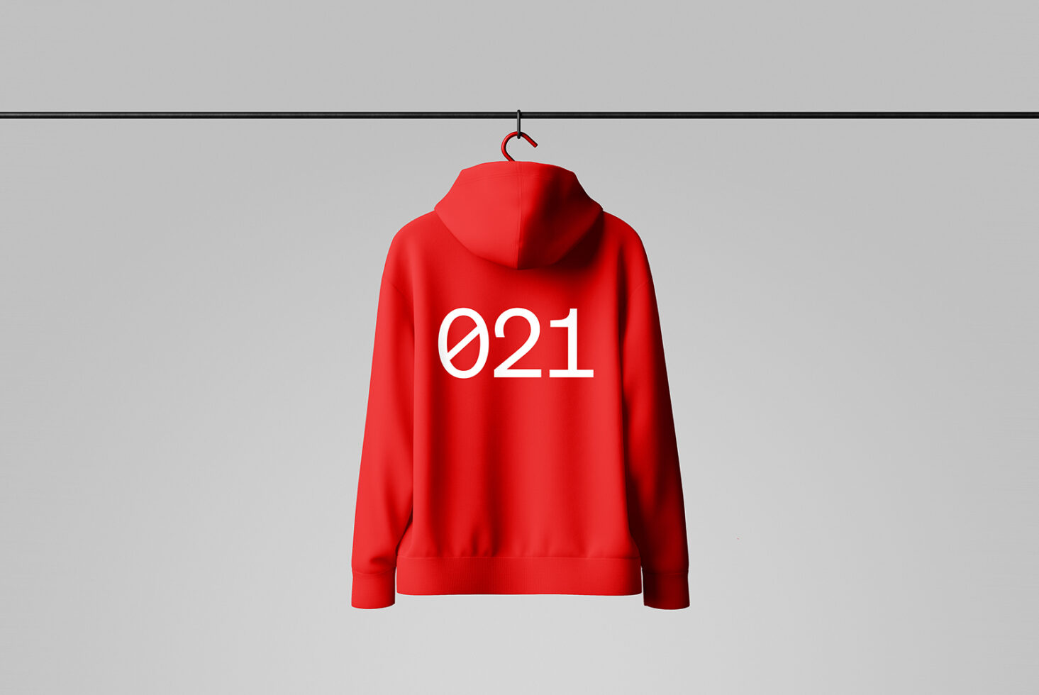 Red hoodie mockup with 021 print displayed on hanger. Ideal for fashion designers and graphic artists. Apparel design template for custom branding.