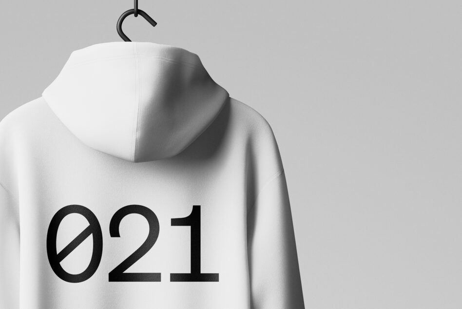 Mockup of a white hoodie hanging on a hook, featuring bold black numbers on the back. Perfect for designers seeking customizable apparel graphics.