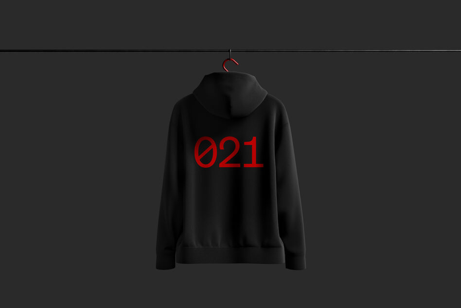 Black hoodie mockup on hanger featuring bold red typography 021 on the back minimalistic design for apparel templates fashion designers clothing mockups