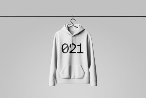 White hoodie mockup on hanger with bold black number 021 on front. Minimalist fashion design template for designers. High-quality apparel graphics.