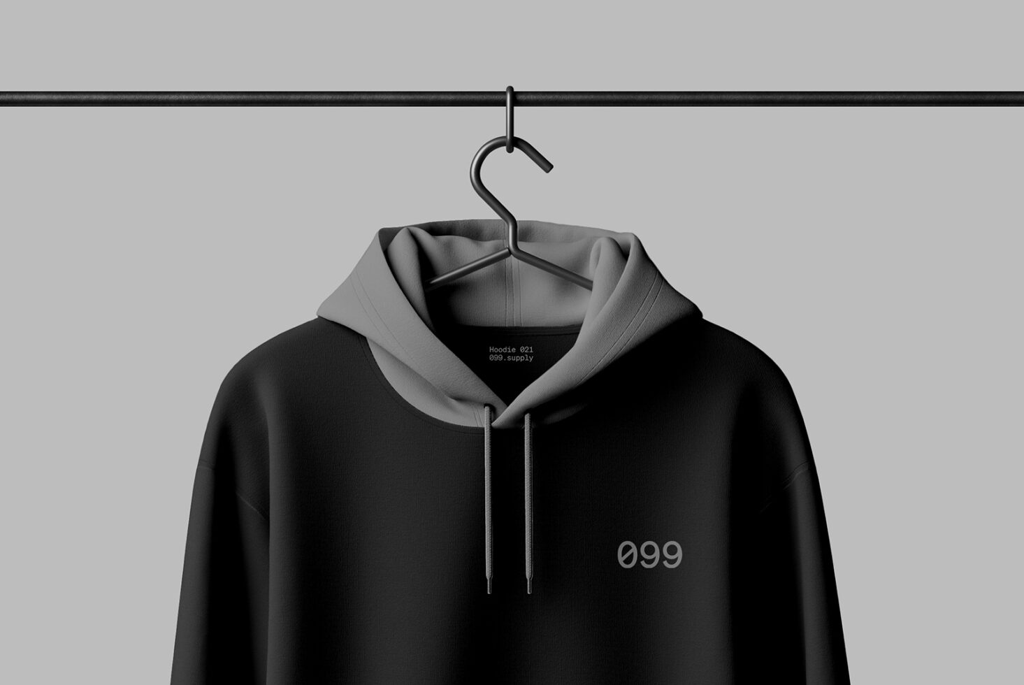 Minimalist black hoodie mockup on hanger against gray background perfect for fashion designers showcasing apparel design templates and branding.