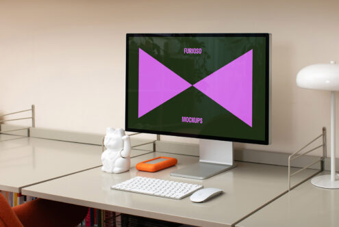 Workspace with desktop computer displaying Furioso Mockups on screen. Minimalist desk with keyboard, mouse, and decorative items. Perfect for designers.