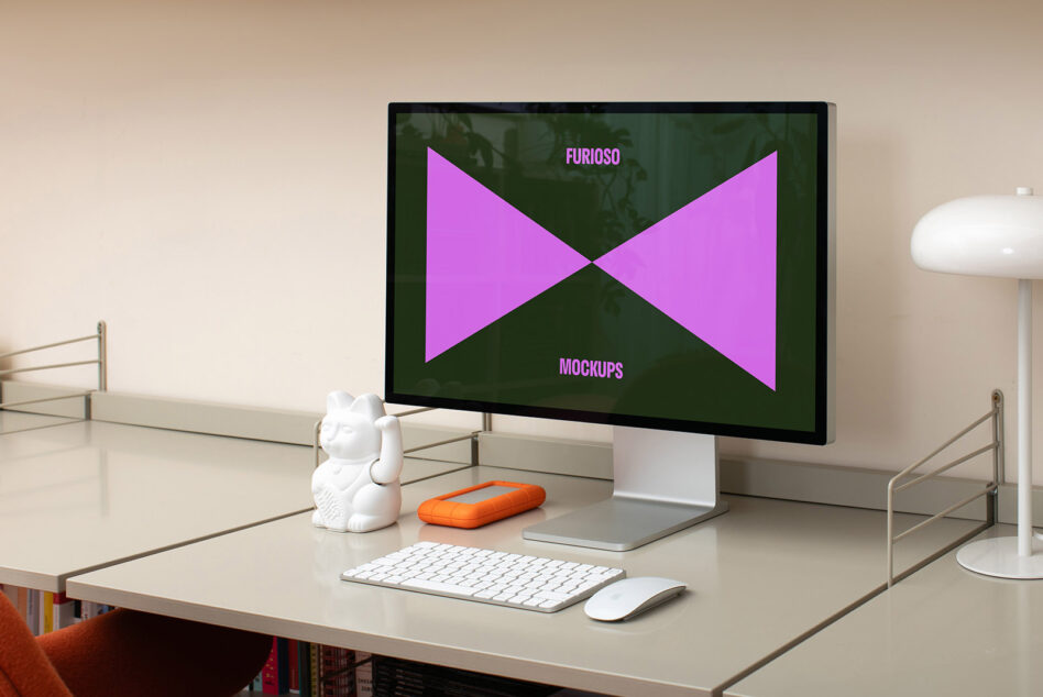 Workspace with desktop computer displaying Furioso Mockups on screen. Minimalist desk with keyboard, mouse, and decorative items. Perfect for designers.