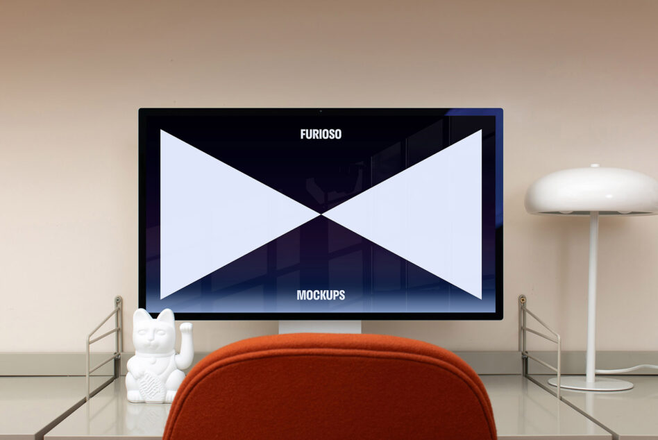 Minimalistic desktop setup featuring a computer screen displaying a mockup design with a modern lamp and decorative figurine. Keywords: mockup design desktop.