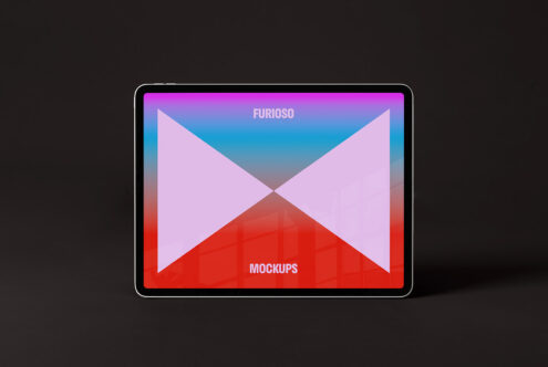 Tablet mockup with colorful geometric background on a dark surface ideal for designers showcasing digital assets graphic design and creative presentations.