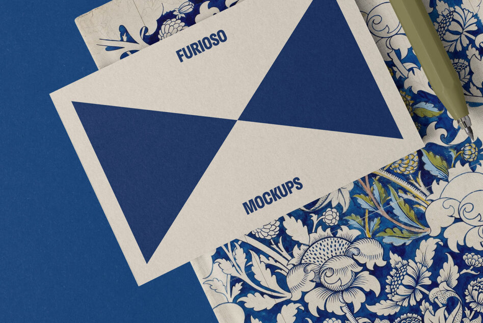 Mockup with blue geometric card on floral patterned fabric background ideal for designers. Use for graphic design projects layout presentations resources.