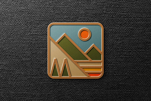 Geometric mountain design graphic badge on textured background showcasing abstract shapes and earthy tones. Suitable for designers' templates and mockups.