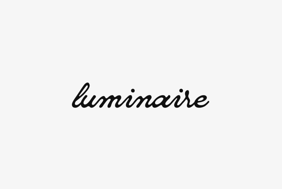 Cursive font spelling luminaire on a white background perfect for designers creating logos banners or digital projects in need of elegant typography graphics