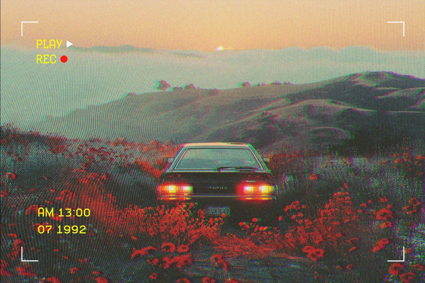 Retro car in scenic landscape with vibrant flowers 1990s VHS style digital mockup template for designers seeking nostalgia and vintage aesthetics.