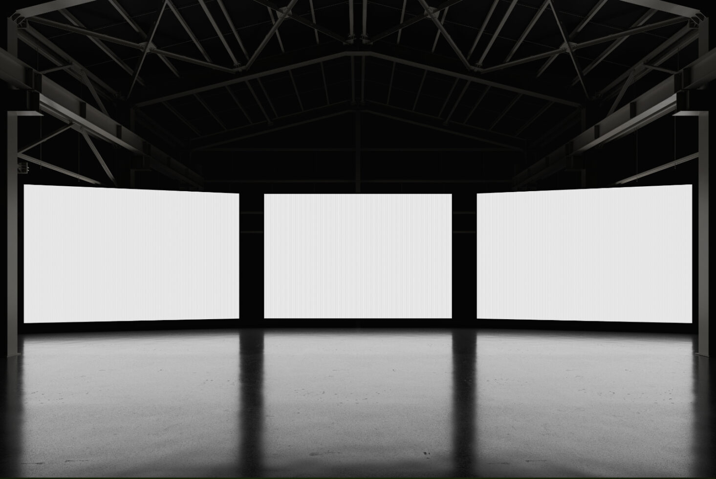 Large industrial space with three blank screens for design mockups. Ideal for showcasing graphic templates. Keywords: mockups, templates, graphics.